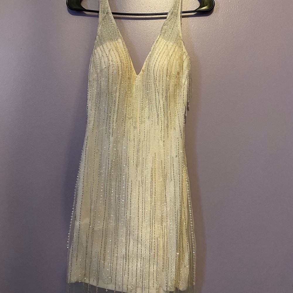 Beautiful champagne/cream colored homecoming dress. worn once. size 1
